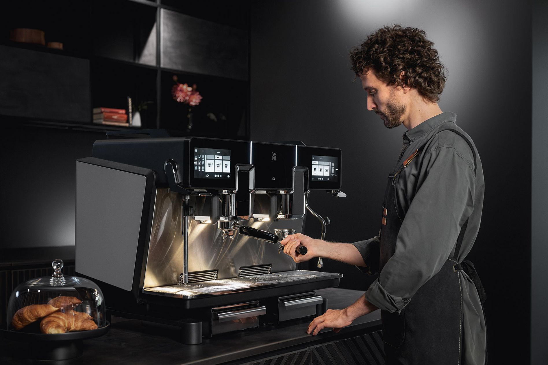 Man using the WMF espresso NEXT portafilter machine